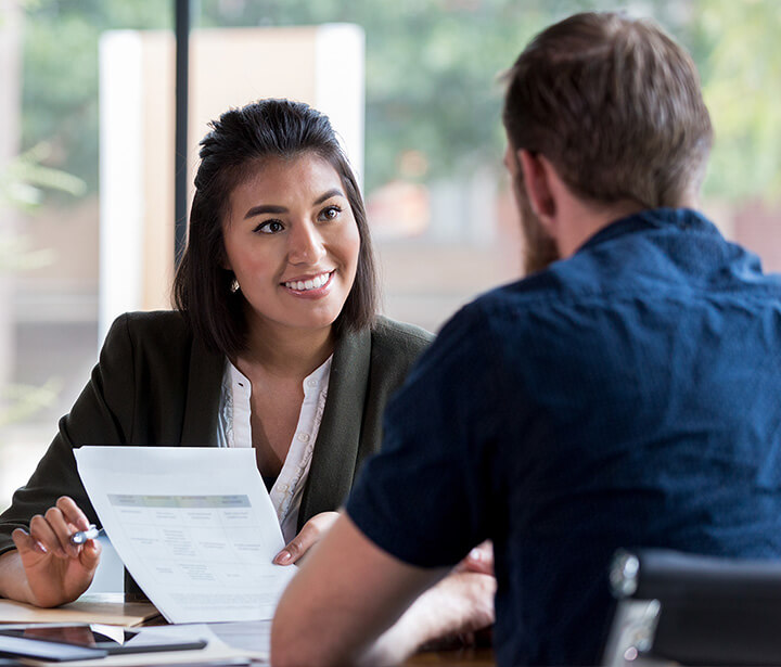 Image of an insurance agent assisting a customer.